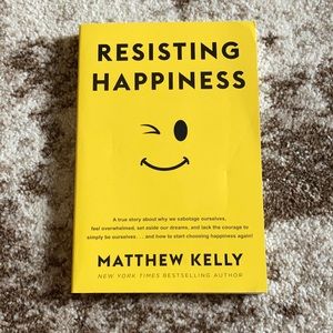 Book resisting happiness